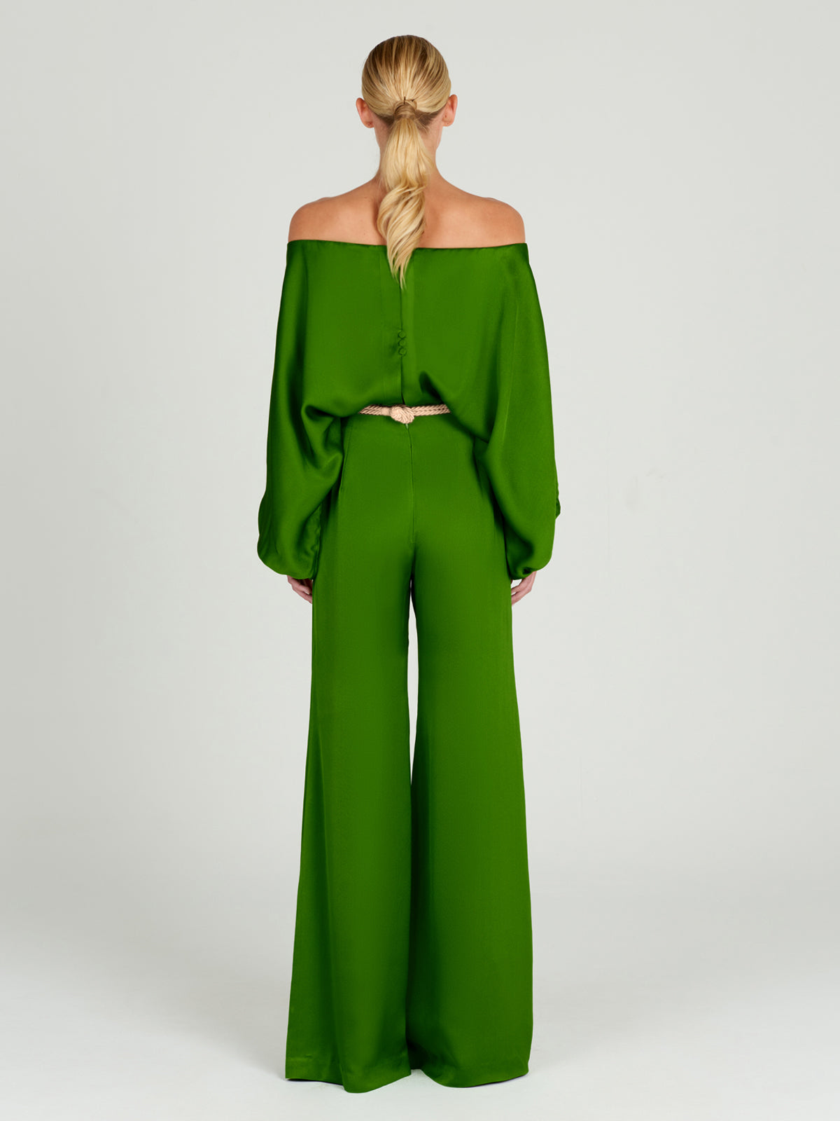 A Theresa Jumpsuit Lime with ruffled sleeves.