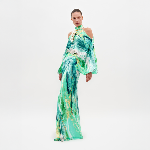 A model showcases a high-neck dress with green and blue abstract marble print, featuring cut-out shoulders, complemented by an ornate white necklace against a plain backdrop. Note: Dress differs from "Claudia Skirt" by SVT DESIGNS.