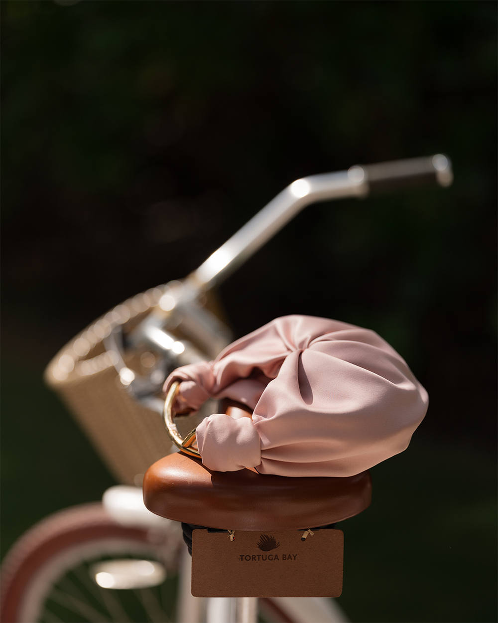 The Sofia Bag on a bicycle seat with a blurred background
