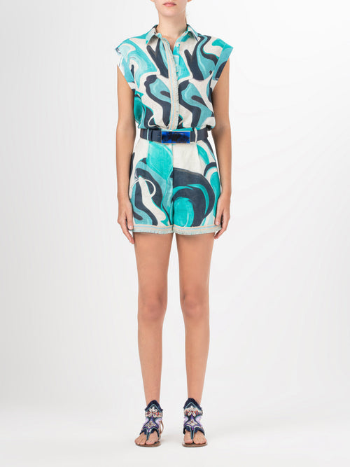 A Rina Blouse Turquoise Marble with a blue and white abstract print.