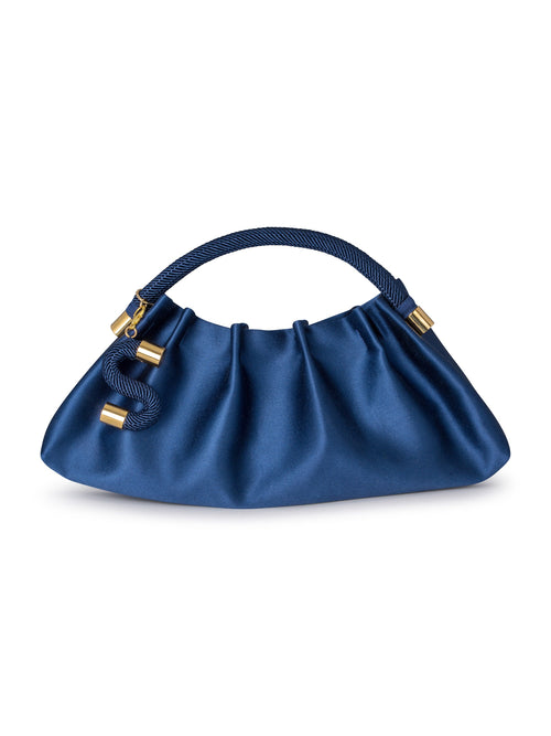 The ST Clutch Navy, featuring a curved pleated design in blue satin with a rope handle and gold accents, will debut on September 2nd, 2024.