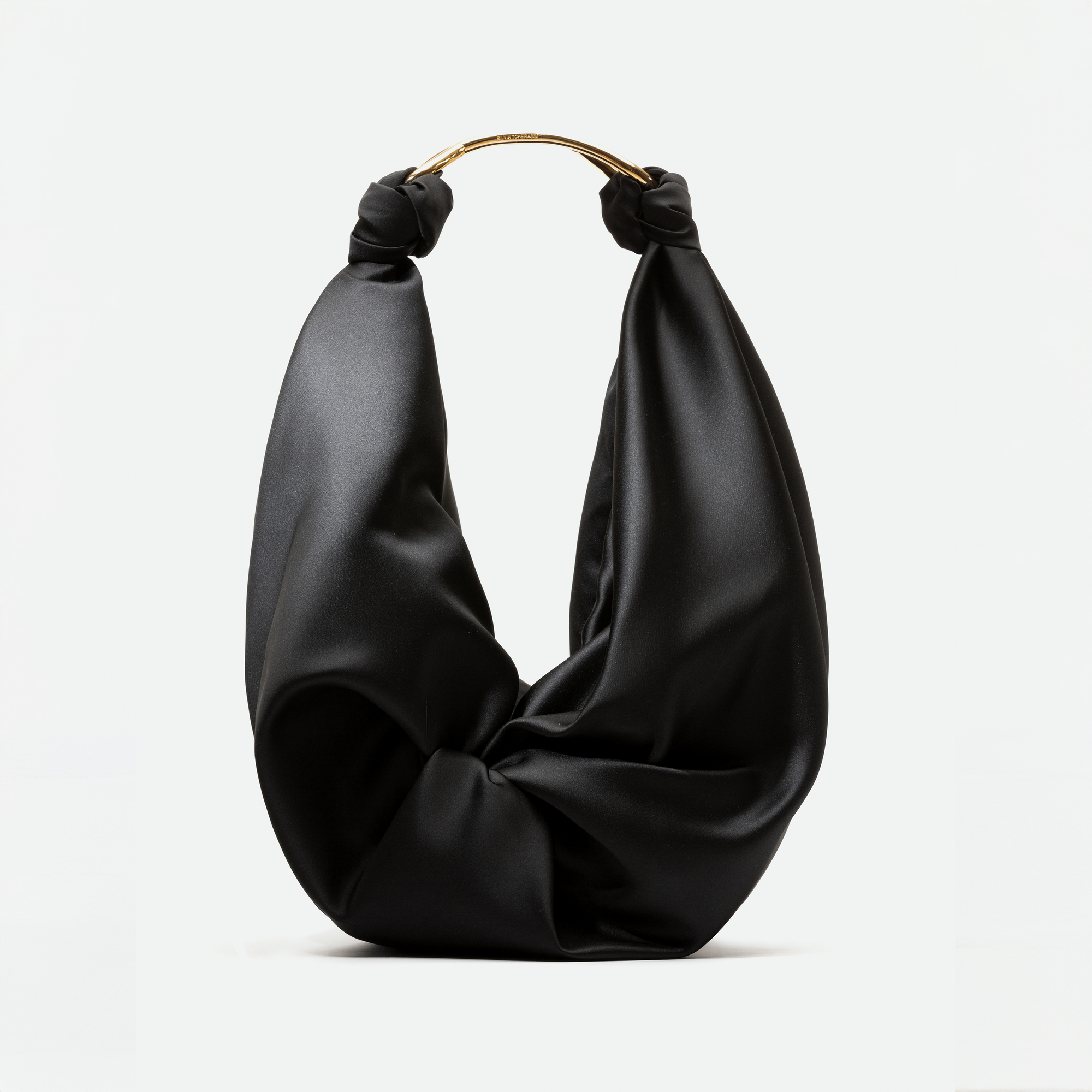 The Sofia Bag (Maxi) is a black satin bag with a twisted knotted design in luxurious doppio raso, featuring a gold metal handle, shown on a white background.