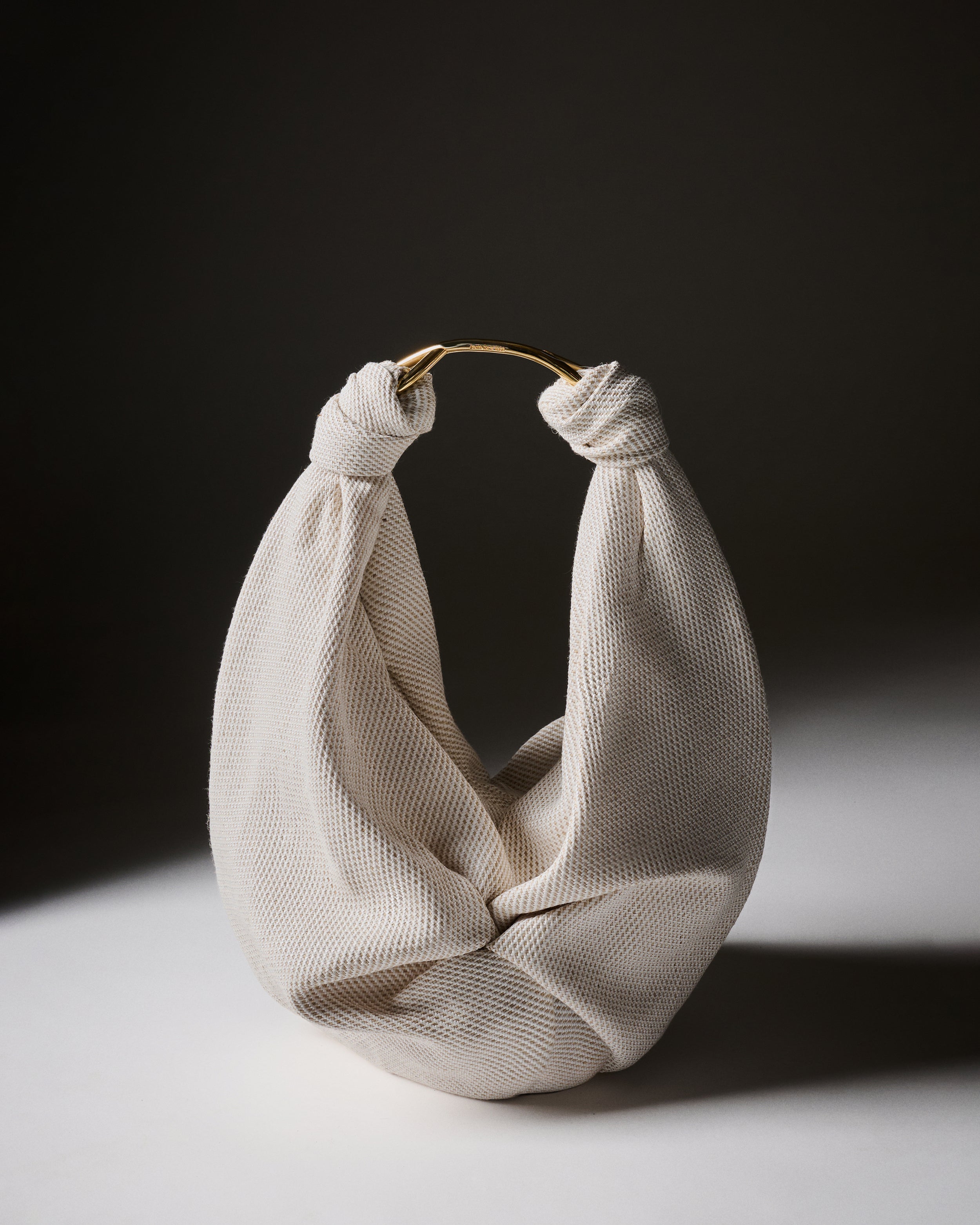 The Sofia Tennis bag on a dark background