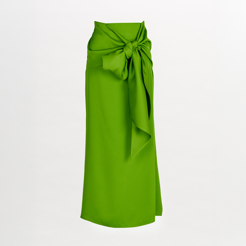 The Trento Skirt is an ankle-length, bright green lime viscose skirt with a high waist, a front-tied elegant bow, smooth texture, and a straight, slightly draped silhouette.