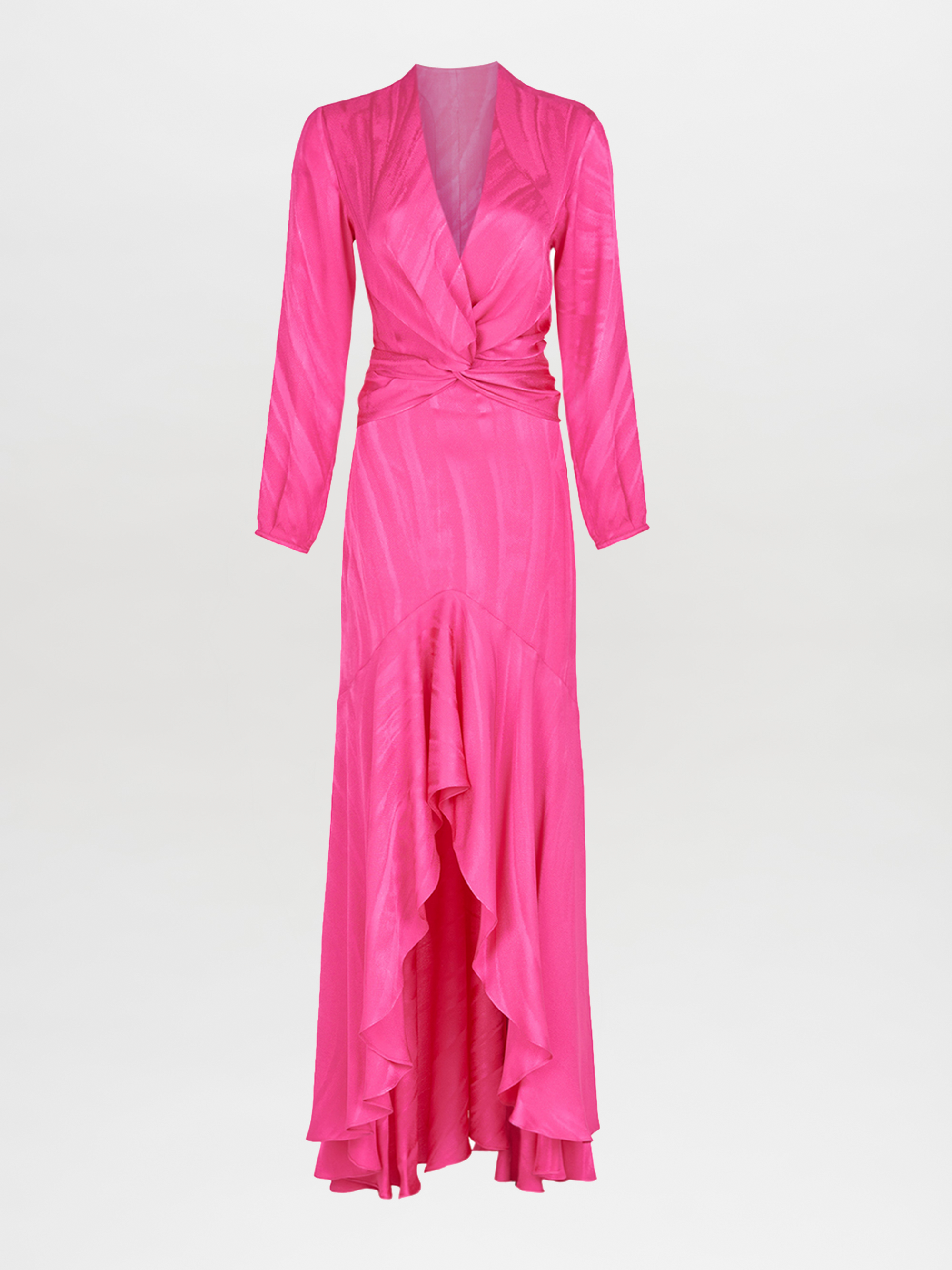 The Silvia Tcherassi Albarella Dress Fuchsia is a long, bright pink dress with a wrap-style top and long sleeves. It features a waist-slimming bow tie, gathered waist, and high-low hem with ruffled detailing against a plain white backdrop.