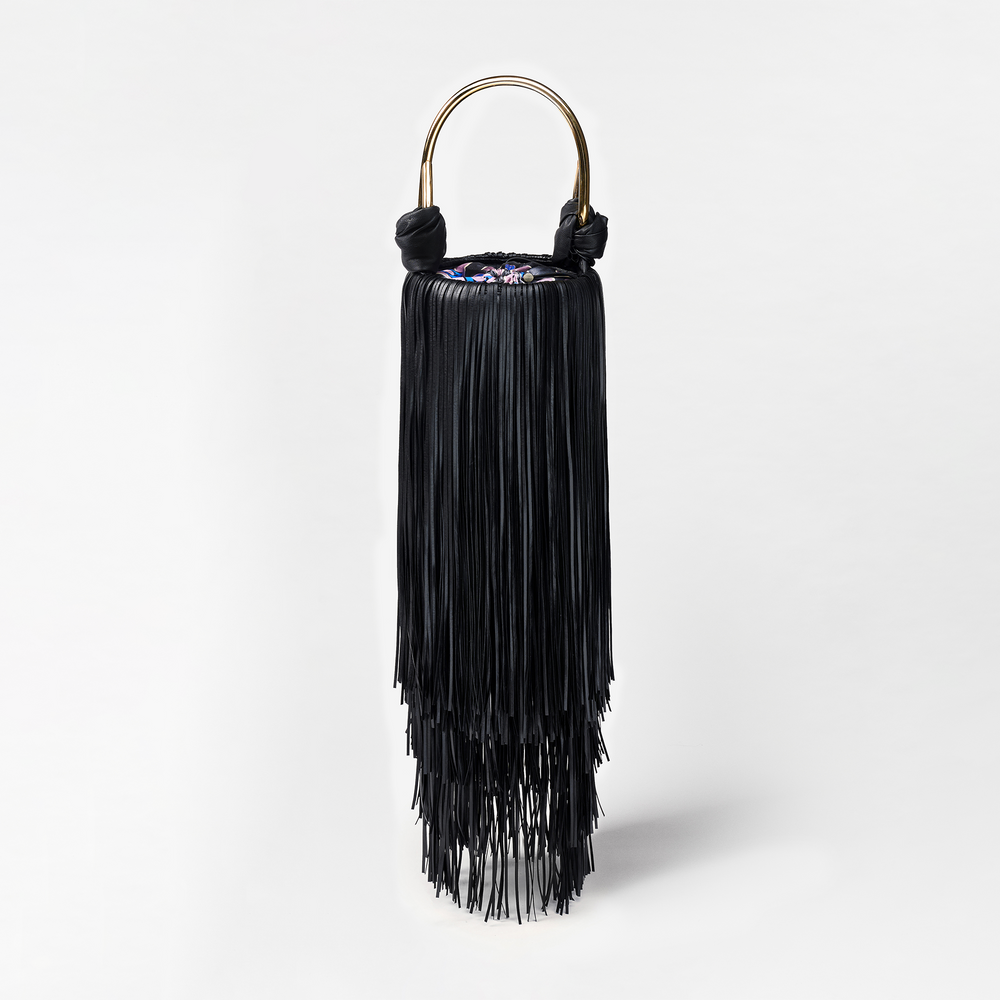 Black fringe handbag with gold handle on a white background