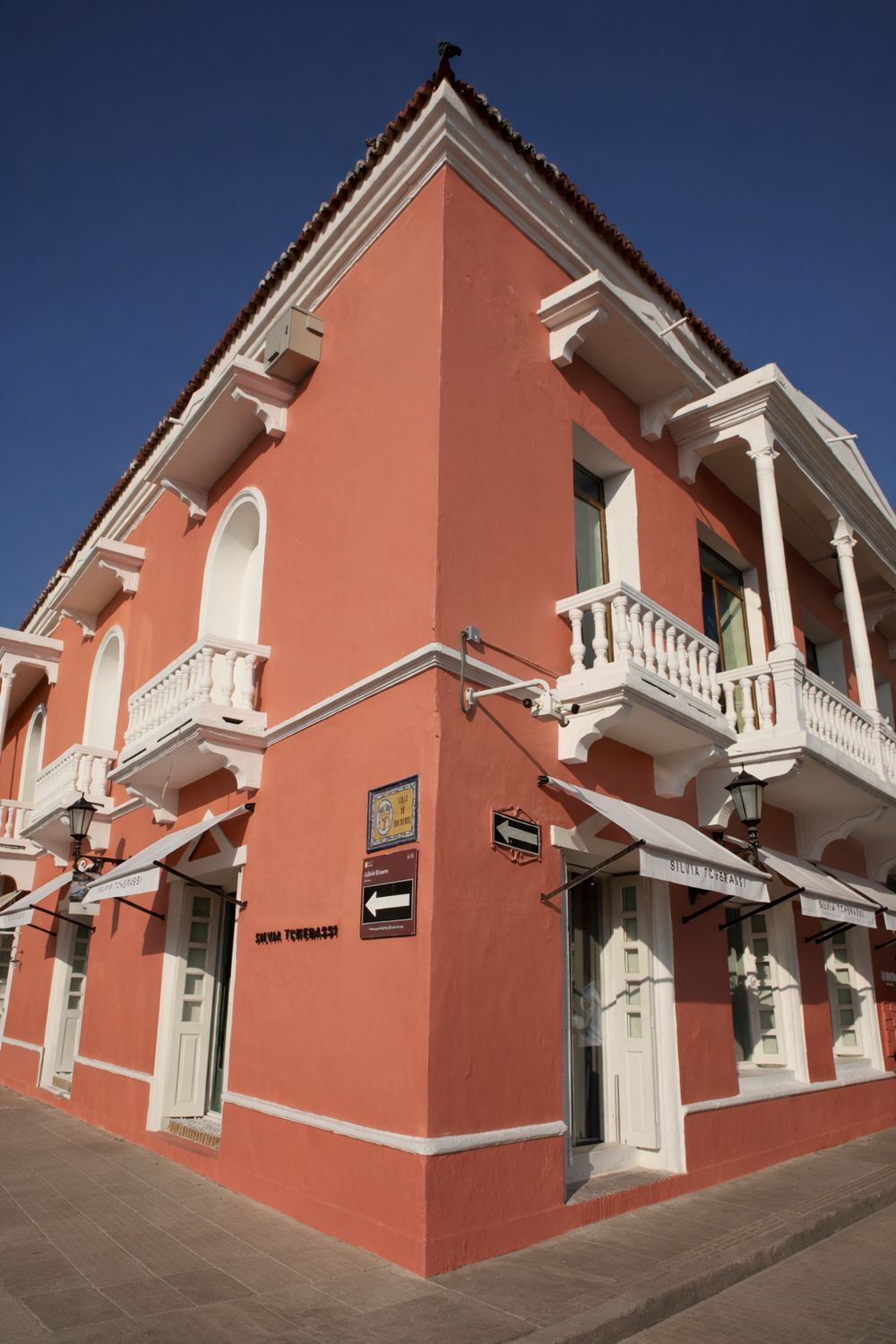 Red building with white accents on a clear day