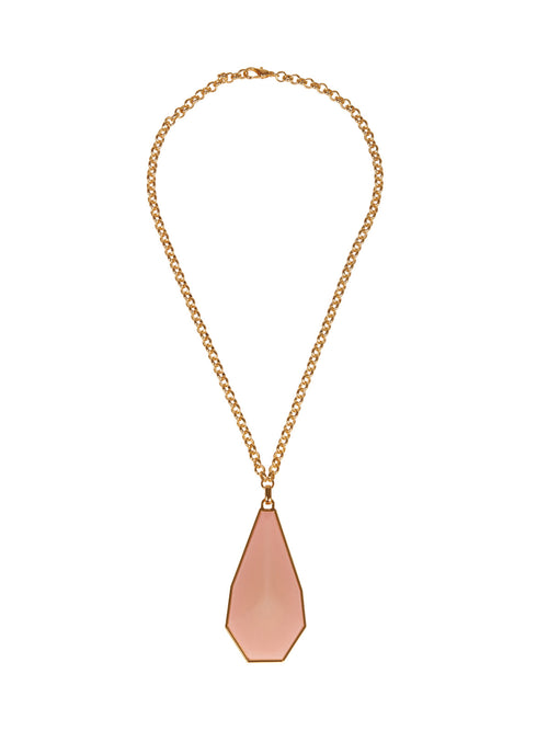 The Ascoli Necklace by Silvia Tcherassi features a gold chain and a large faceted pink geometric pendant, ready to ship upon order.