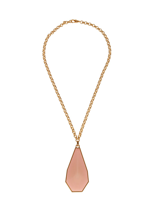 The Ascoli Necklace by Silvia Tcherassi features a gold chain and a large faceted pink geometric pendant, ready to ship upon order.