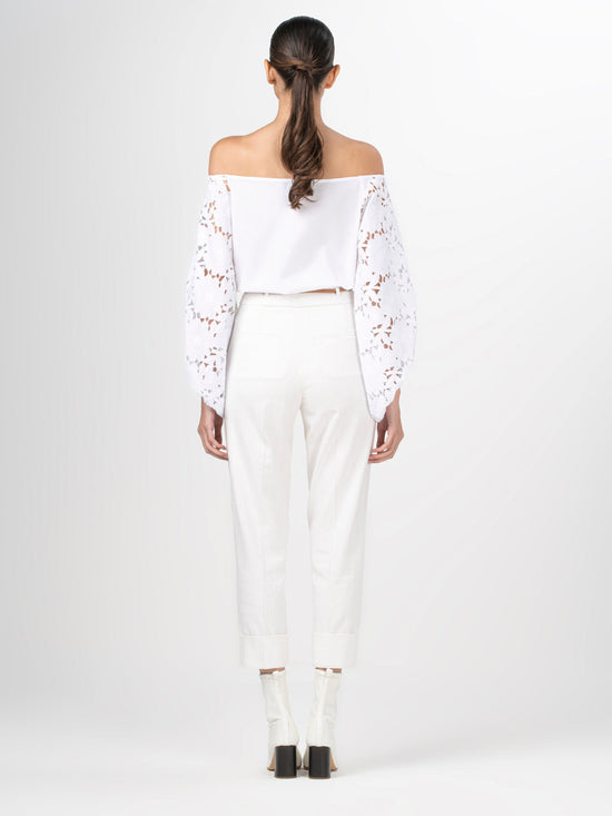 A white Stephanie Blouse White with lace bishop sleeves.